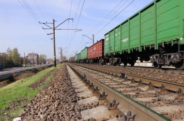 freight train passing by railroad in the city