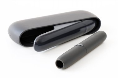 tobacco heating device on a white surface, an alternative to traditional cigarettes