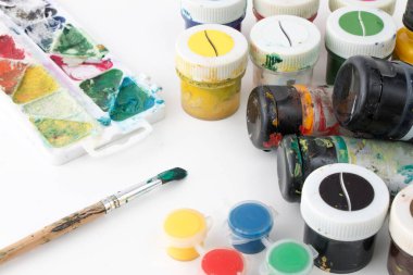 Paint brushes and paints for drawing, isolated on white background