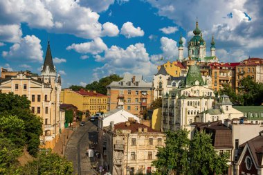 Picturesque view to Andrew's church, Andriivsky descent, Richard the Lionheart House and historic buildings in the center of Ukrainian capital, Kyiv, Ukraine clipart