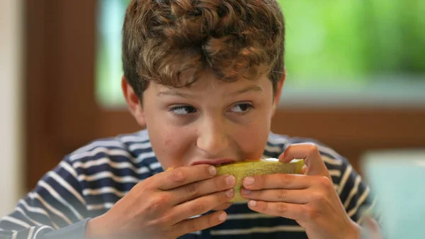 Young Boy Eating Melon Fruit Child Eats Healthy Food — Fotografia de Stock