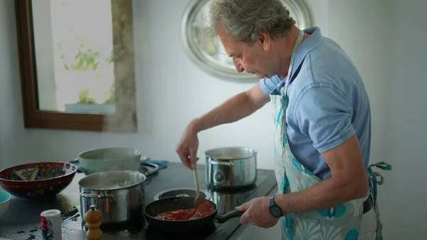 Senior Man Cooking Kitchen Older Person Stirring Pot Preparing Food — Stockfoto