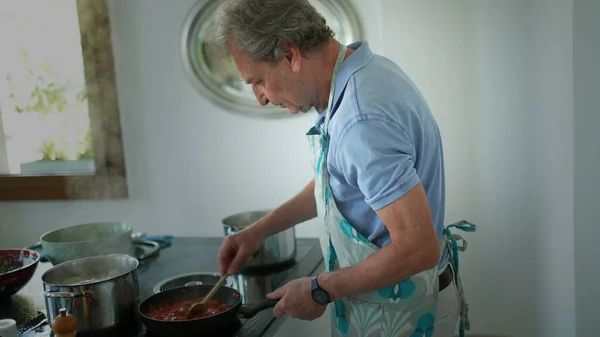 Senior Man Cooking Kitchen Older Person Stirring Pot Preparing Food — Foto de Stock