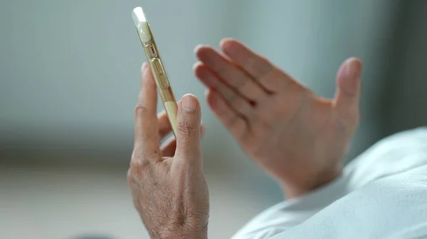 Person holding phone, close-up hands using cellphone