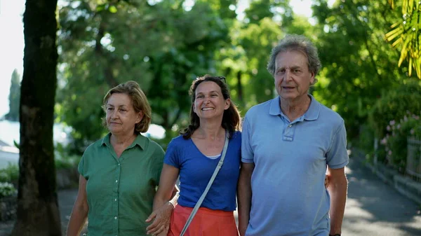 Parents Walking Adult Daughter Together Family Day Walk Laughing Smiling — Fotografia de Stock