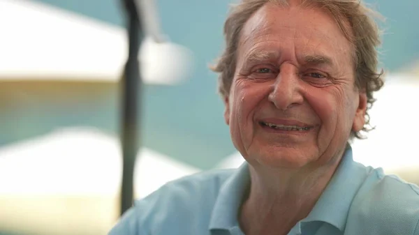 Older man laughing and smiling, portrait senior person real life laugh and smile