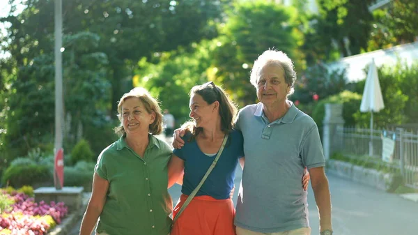 Joyful Daughter Walking Senior Parents Together Green City Laughing Smiling — Fotografia de Stock
