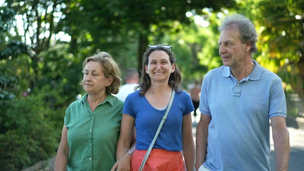 Family Walking Together Green City Happy Adult Daughter Senior Parents — Fotografia de Stock