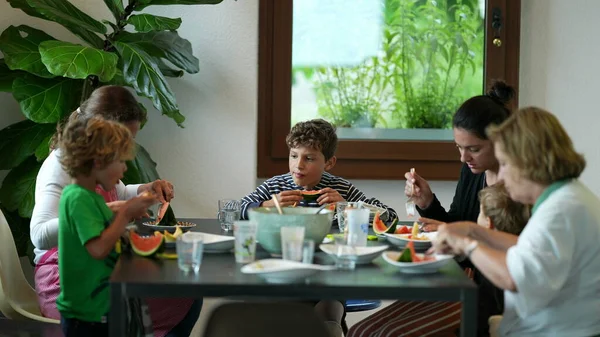 Family Sitting Table Eating Food Indoors — Foto de Stock