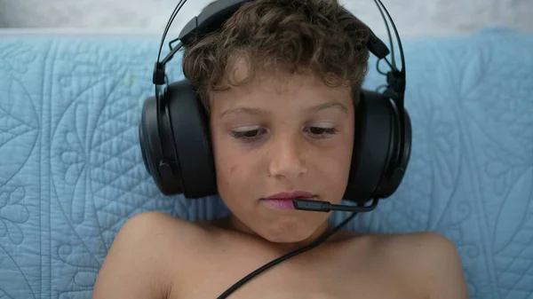 Child Plays Game Tablet Wearing Headset Online — Photo