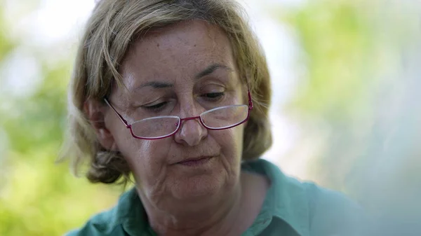 Candid Older Senior Woman Wearing Reading Glasses Speaking — Stock Photo, Image