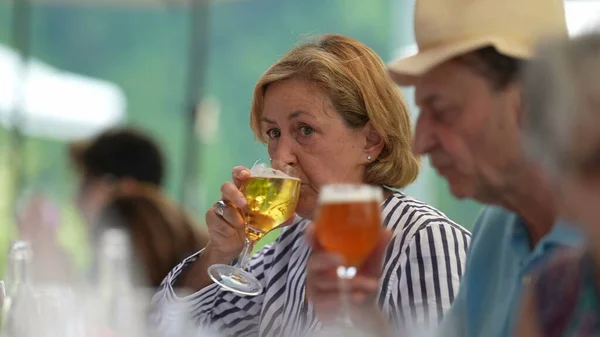 Candid Older Couple Drinking Beer Senior Woman Drinks Draft Glass — Stockfoto