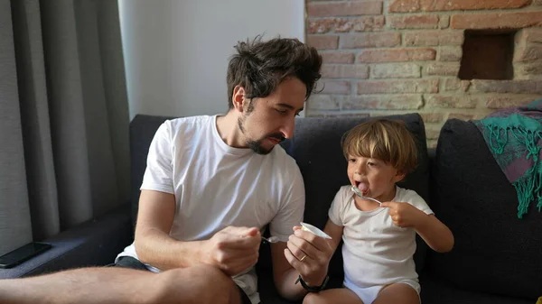 Father Son Eating Yogurt Together Dad Boy Bonding Real Life — Stock Photo, Image