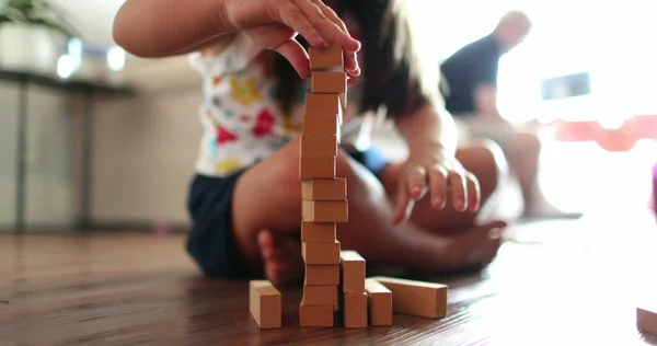 Little Girl Playing Building Wooden Blocks Home — ストック写真