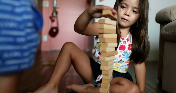 Little Girl Playing Building Wooden Blocks Home — Stock Fotó