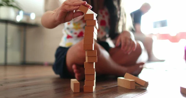 Child Adding Wooden Blocks Vertical Building — ストック写真