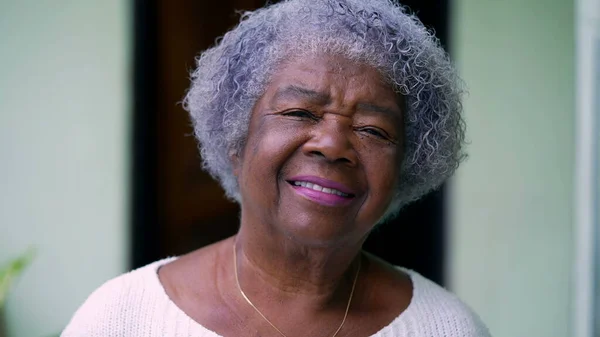 A senior African woman portrait smiling at camera closeup face