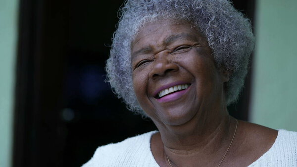 An African senior woman laughing and smiling portrait face