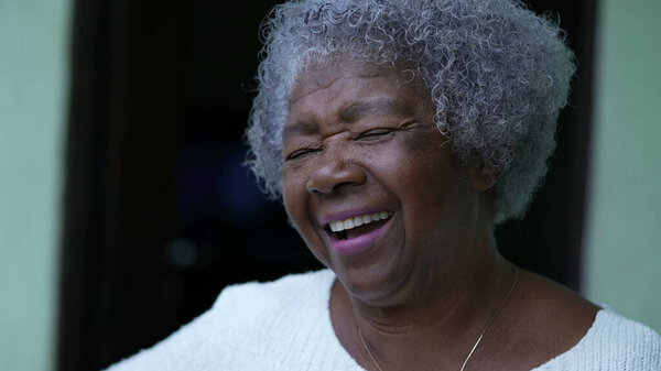 An African senior woman laughing and smiling portrait face