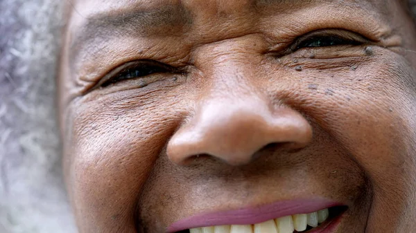 A Happy senior black woman close-up eyes and mouth