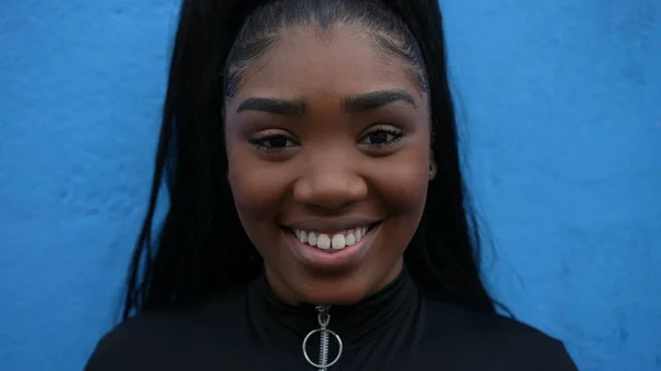 Brazilian Girl Portrait Smiling Camera Leaning Blue Wall African Young — Fotografie, imagine de stoc