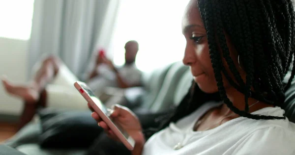 Teen Daughter Father Sitting Home Sofa Using Smartphone Device Each — Photo