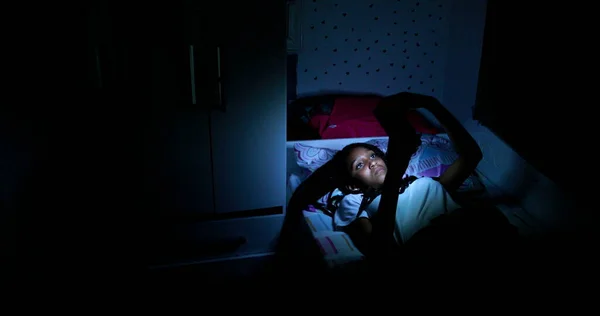 Teen Black Girl Using Cellphone Device Night Bed — Stock Fotó