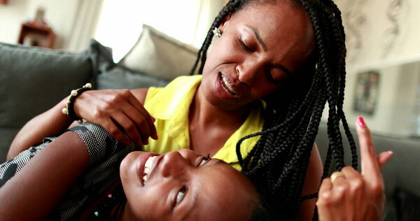 Mother and teenage daughter love and affection, african mixed race ethnicity