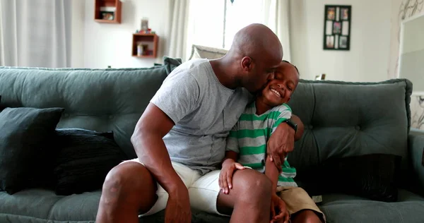 Mixed Race Father Kissing Son Boy Cheek Home Sofa — 스톡 사진