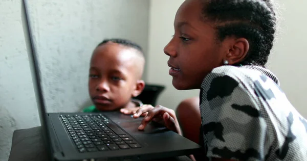 African Teen Girl Browsing Internet Laptop Little Brother Watching Next — Stock Photo, Image