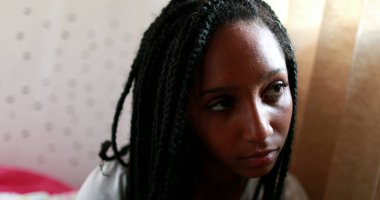 Pensive black teen girl. Thoughtful African american adolescent teenager in dilemma