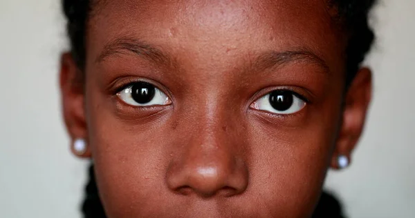 Young Black Girl Close Eyes Staring Camera — Stockfoto