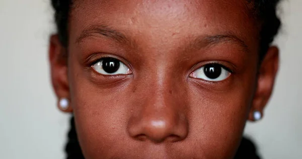 Young Black Girl Close Eyes Staring Camera — Stockfoto