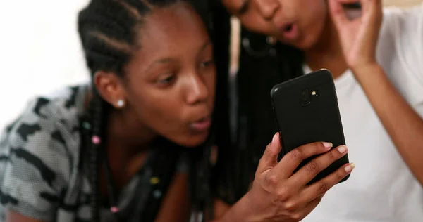 Two Black Girls Looking Cellphone Screen Laughing Together African American — Stockfoto