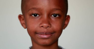 Serious African little boy portrait looking at camera