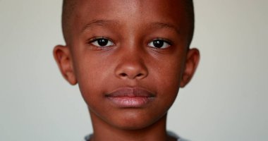 Serious African little boy portrait looking at camera