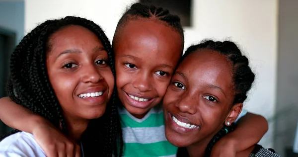 Little Brother Embracing Teen Sisters African Mixed Race Black Ethnicity —  Fotos de Stock