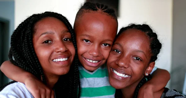 Little Brother Embracing Teen Sisters African Mixed Race Black Ethnicity — Zdjęcie stockowe