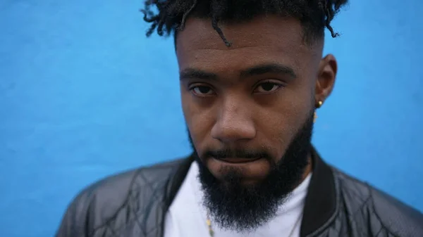 Portrait of a black man face closeup looking at camera