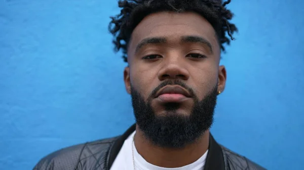 Portrait of a black man face closeup looking at camera