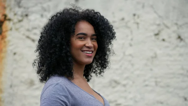 African Latina Black Woman Walking Urban Street Turning Head Camera — ストック写真