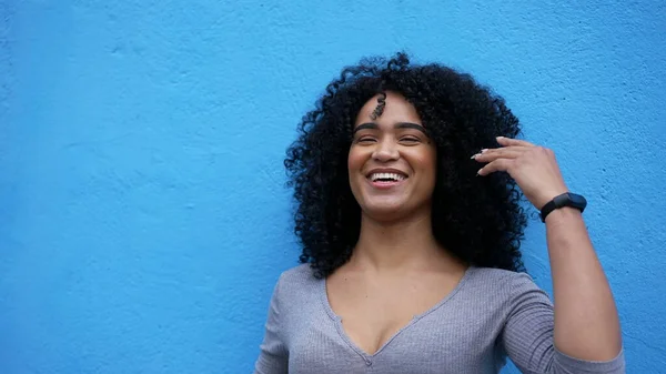 A happy latin African woman laughing and smiling