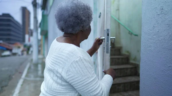 Older Woman Arriving Home Opening Front Gate Entering House —  Fotos de Stock
