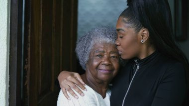 A teen granddaughter taking care of grandmother giving help and support