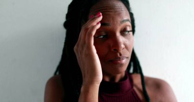 Worried black woman feeling anxious