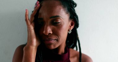 Worried black woman feeling anguish. anxious African female