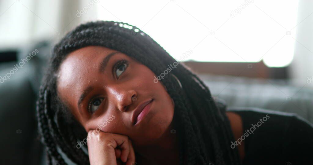 Pensive black teen girl thinking, Thoughtful African mixed race young woman