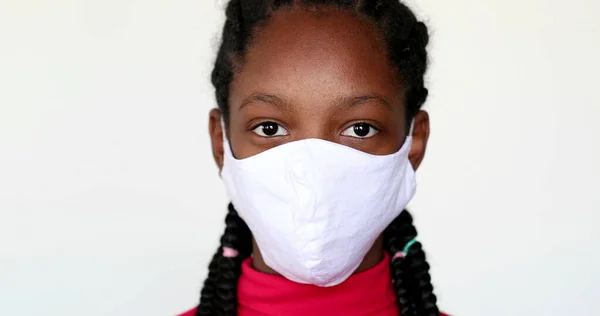 Teen Black Girl Putting Face Mask Looking Camera — Fotografia de Stock