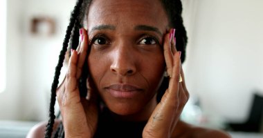 Anxious black African woman, stressed lady portrait face