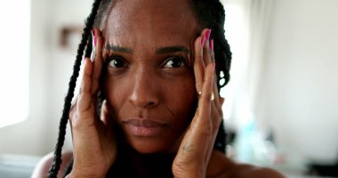 Anxious black African woman, stressed lady portrait face